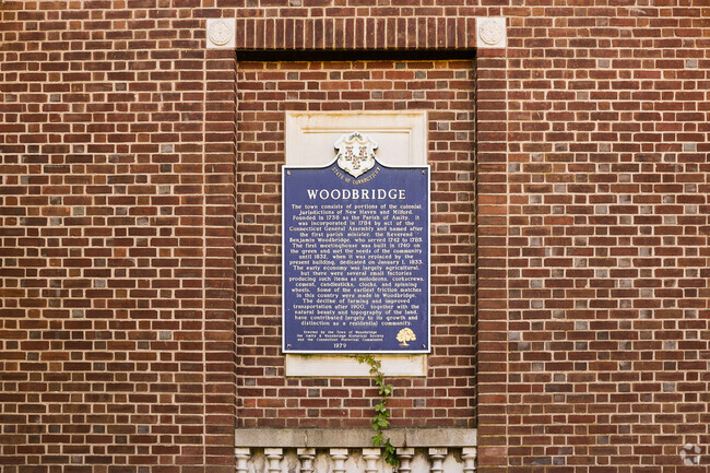 A plaque outside the Town Center gives a brief history of the Town of Woodbridge.