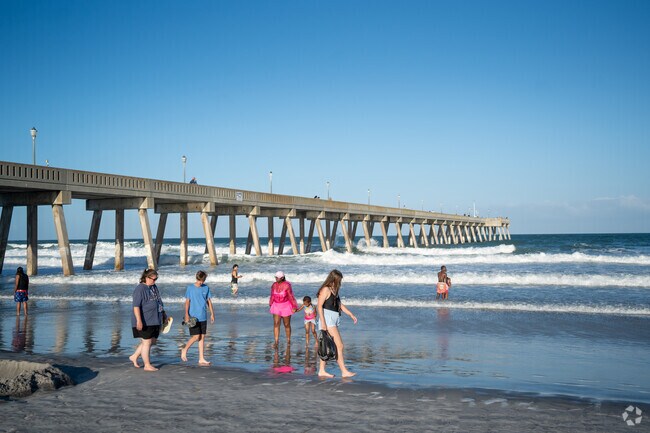 Residents can sink their toes in the sand, walking up and down Wrightsville Beach.