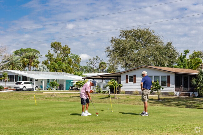 Sharpen your short game on the pristine greens at Del Tura Golf & Country Club in Jacaranda.