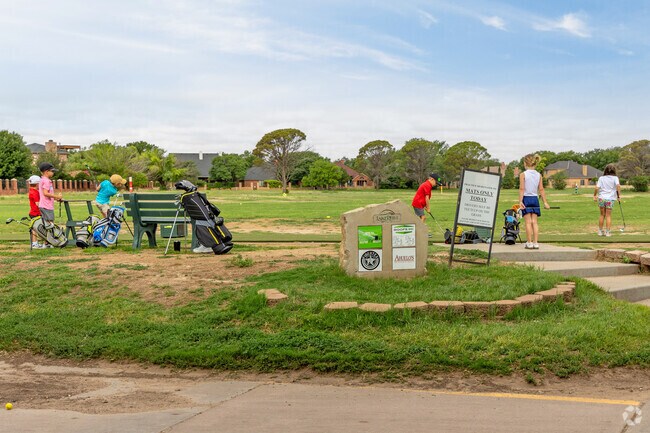 Kids love learning to play golf at Lake Ridge Country Club near Kings Gate.