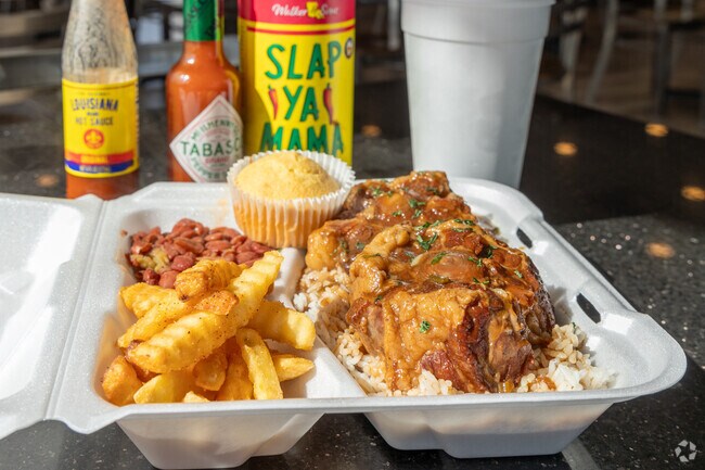 Try the smothered oxtails with beans and fries at Soul Haus Kitchen in Arnould Heights.