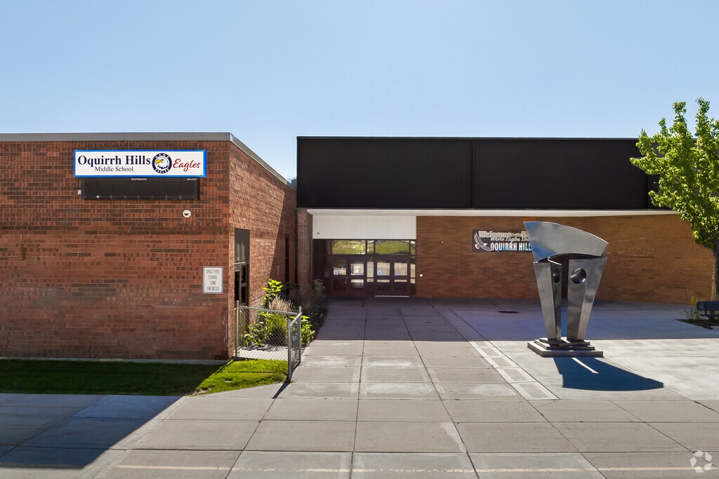 Red brick, black detail and clean lines at the entrance of Oquirrh Hills Middle School.