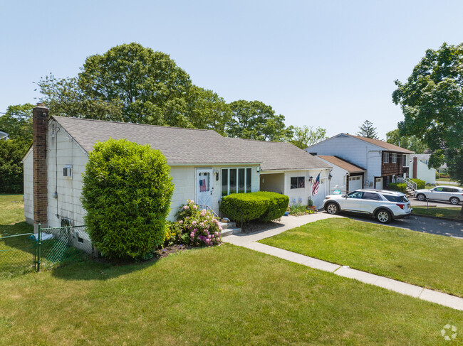 Holtsville features inviting ranch style homes that come with ample yard space.