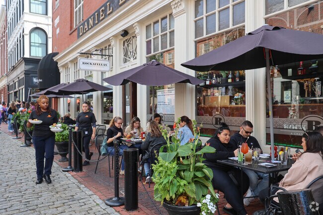 Residents in South Salem enjoy people watching at Rockefellas on Essex Street.