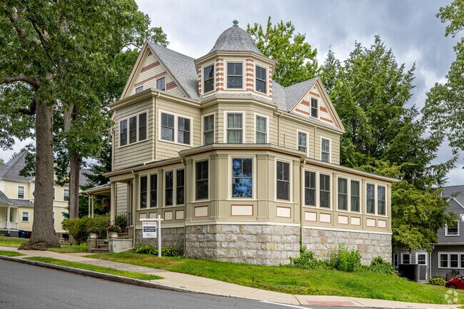 A beautiful Victorian style home sits at the top of a hill in the Wyoming neighborhood of Melrose, MA.