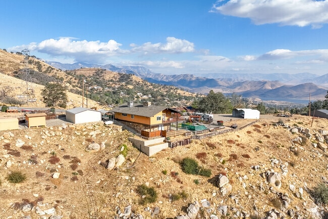 This home, nestled on top a cliff in Wofford Heights, has a great backyard view.