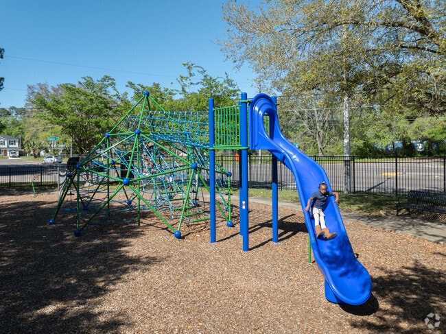Kids love to play on the swings and slide at Garden City Park.