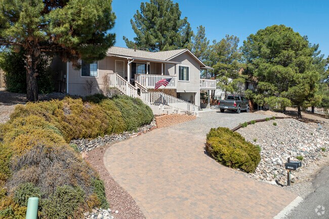 Older ranch homes in Verde Village are surrounded by mature trees, offering shade in the warmer months.