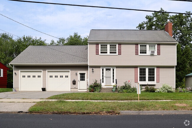 Colonial home with attached garage reflects South Portland’s traditional style.