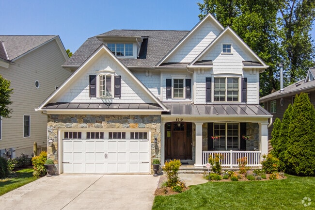 Many homes throughout the Bradmoor neighborhood feature inviting front porches and gardens.
