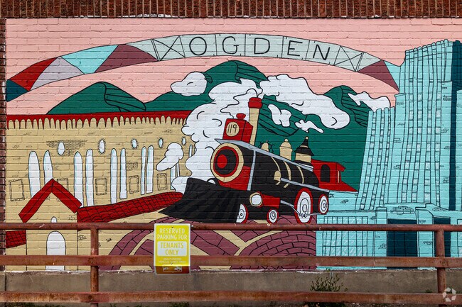 This red and black train stands out amidst pastel colors in this Ogden mural.