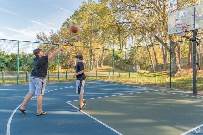 Hunter's Green friends play basketball after school.