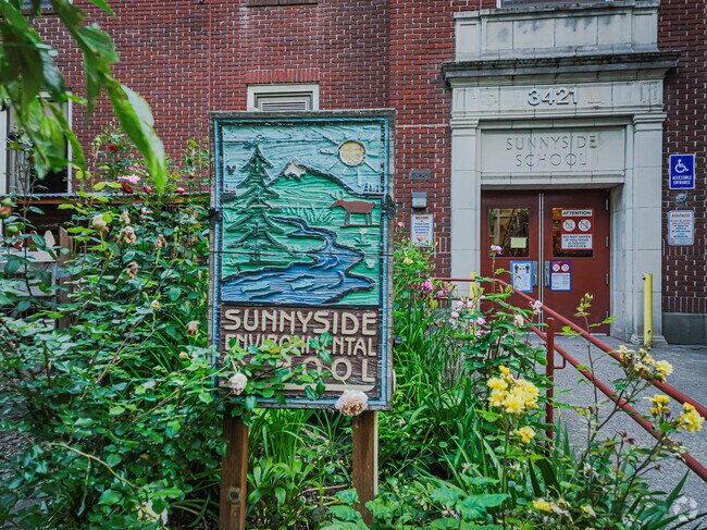 School entrance with a graphic design to Sunnyside Environmental School.