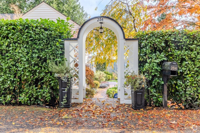 A trellised gate frames the view of the river from the Birdshill neighborhood.