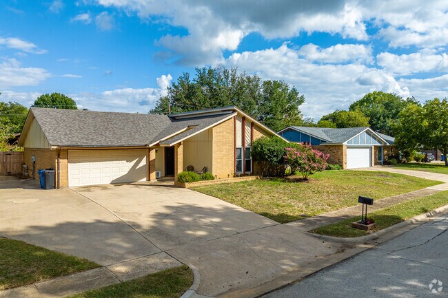 Mid century style ranch homes line the tree filled streets of Bear Creek Park.