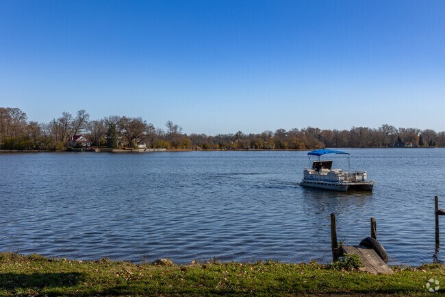 Pontoon boat heading out for the beautiful fall day on Pistakee Lake in East Johnsburg.