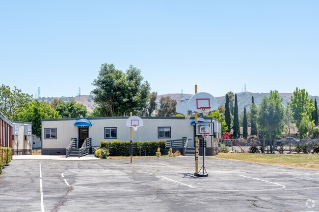 Children of all ages play basketball at California University Prep in Rowland Heights, CA.