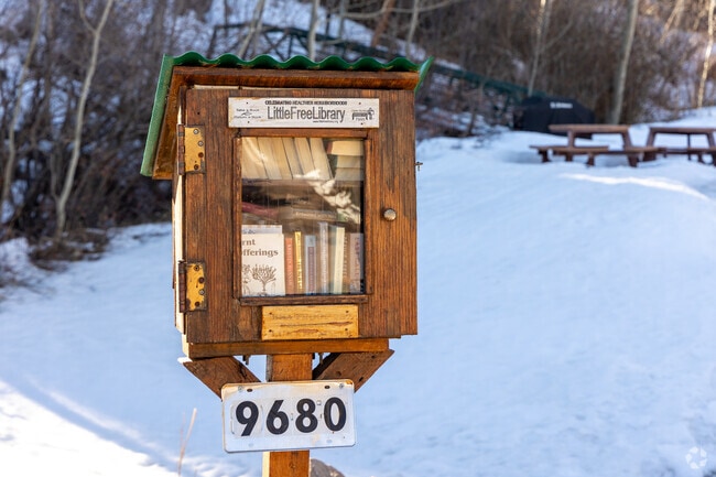 Hilldale Pines features a small free library nestled in Hilldale Pines Park.