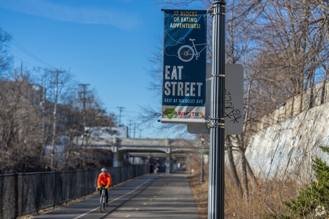 Banners highlighting Eat Street signal to bikers on the Greenway.
