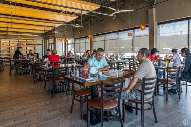 Some friends share a pot of tea and Asian delicacies at Pho Ha Saigon in Lawncrest.