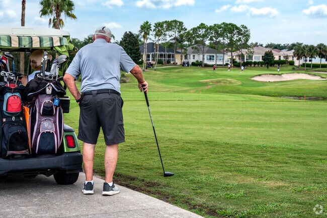 A local looks awaits their turn to tee at Bacall Executive Golf course in the Village of Largo.