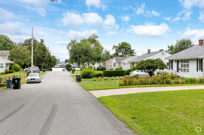 A row of homes in the Massachusetts Touisset neighborhood leads to the glorious Cole River.
