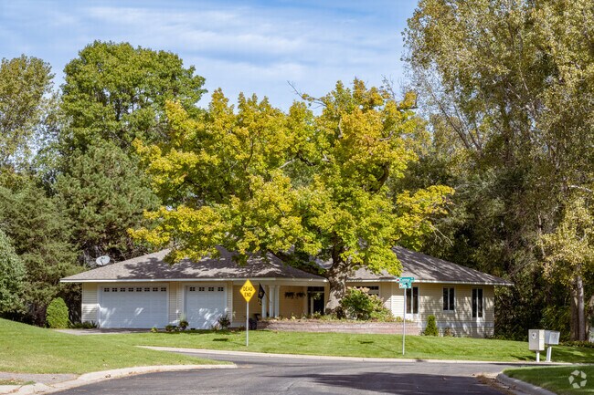 Trees offer shade and serenity to homes in Kohlman Lake.