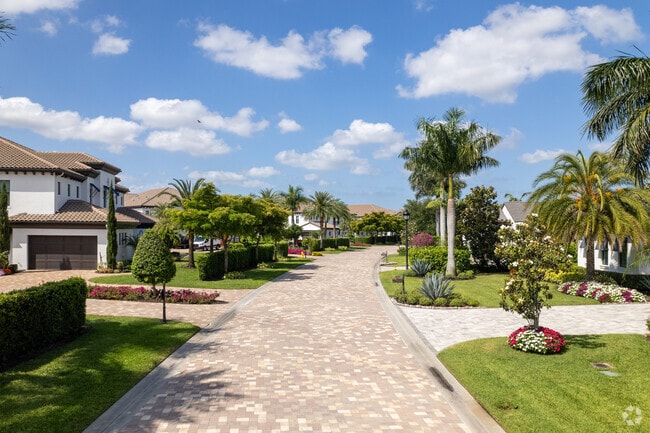 Talis Park streets are paved with brick pavers and lined with meticulously manicured lawns.