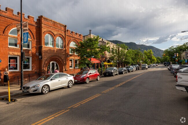 Sunset casts a golden hue on Pearl Street’s storefronts in Downtown Boulder.
