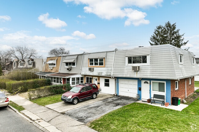 These Rittersville rowhomes have roofs that mimic the classic mansard roof.