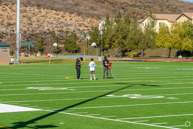 Students brainstorming ideas for their outdoor project at Canyon Hills Community Park.