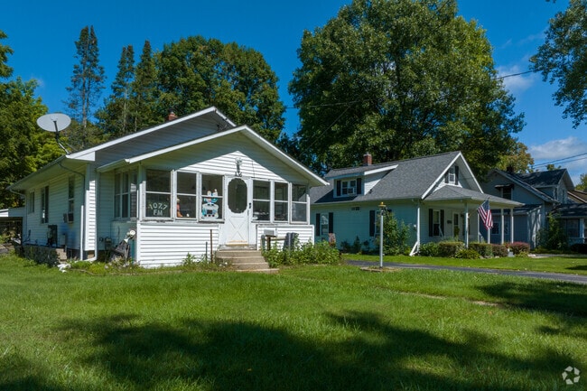 A row of cottages reside in harmony with oak trees in Clio.