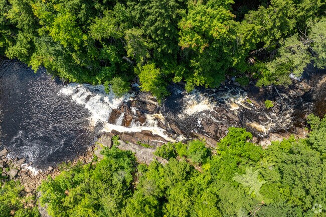 Locals can sit along the rocks at Profile Falls in the Franklin Falls Recreation Area in Hill, NH.