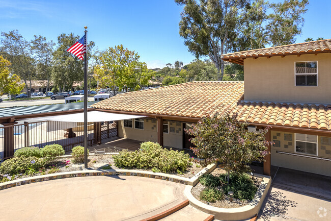 Encinitas Schools The Rhoades School with the American flag raised tall.