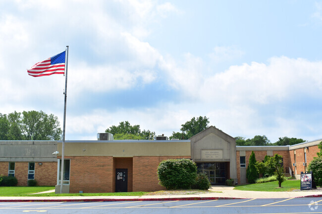 Henry W Cowherd Middle School building in Light of the Community.