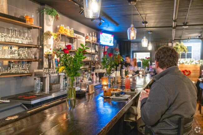 A couple spends their Valentine's day dinner at Bar One near Brookline.