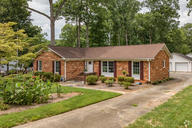 A brick ranch in The Thicket sits on a large lot.