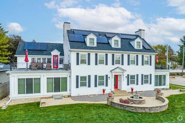 Downtown Bettendorf features beautiful riverfront Colonial Revivals on manicured lawns.