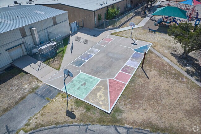 Pflugerville Elementary School has a basketball court for students to play during recess.