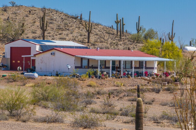 The remote homes of Whispering Ranch are designed for desert living, often featuring outdoor spaces tailored for recreation like off-road vehicles and equestrian activities.