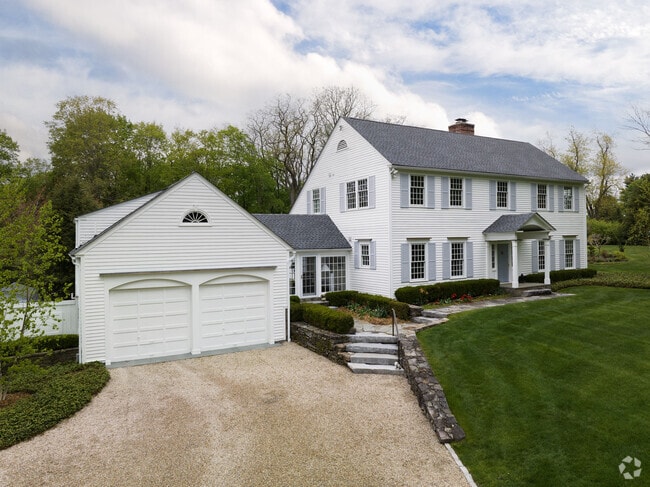 A shell driveway leads to a lovely colonial-style home in Sharon.