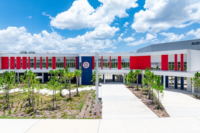 Aubrey Rogers High School welcomes students through the main entrance.
