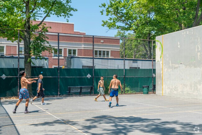 The Painters Playground, with its handball court and play equipment, neighbors P.S. 174.