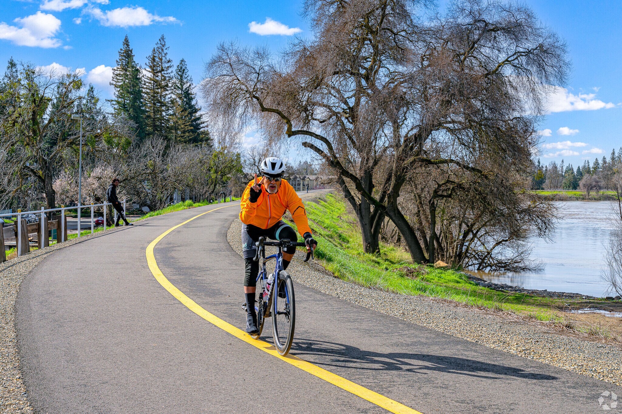 Friendly rider raises peace sign on Sacramento River Bike Trail near Little Pocket.