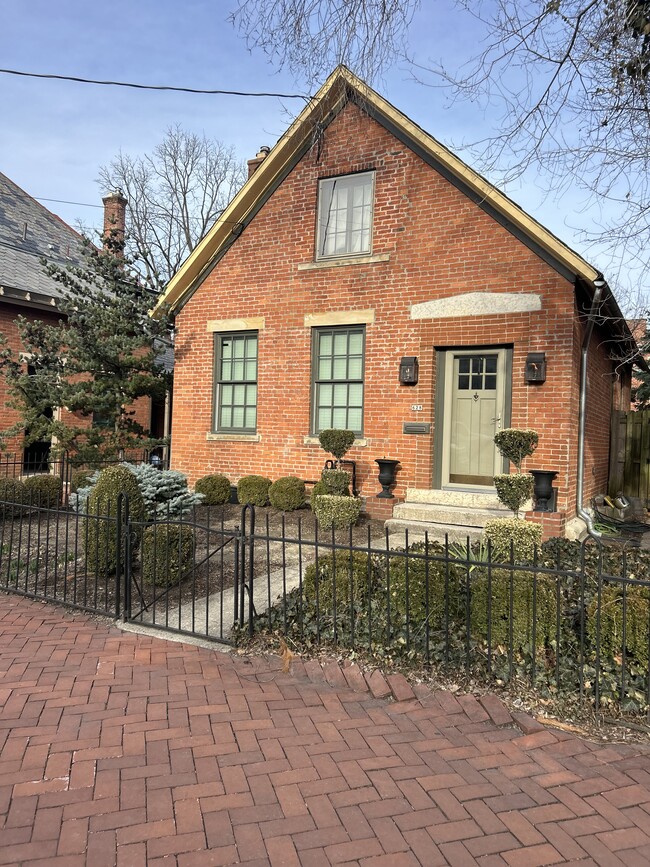 Restored 1850’s Brick Cottage with lovely landscaped FFrint and back yard. On the Main Street of Ge,