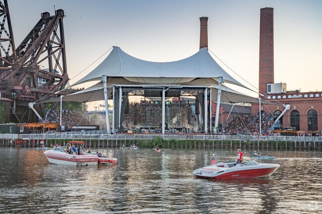 Touring bands at West Bank's Jacobs Pavilion attract large crowds off and on the water.