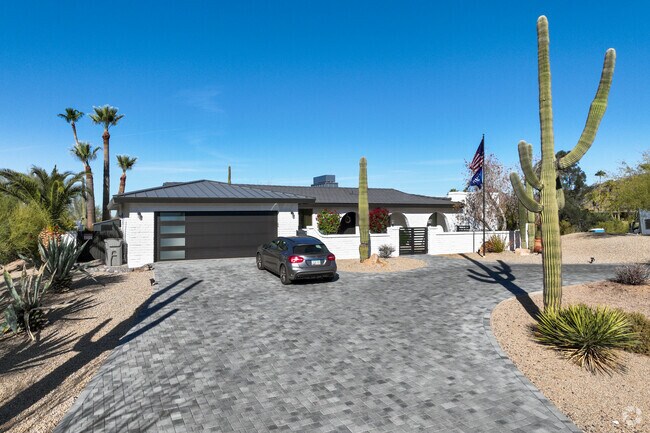 Saguaro cacti are carefully preserved during home construction in Carefree.