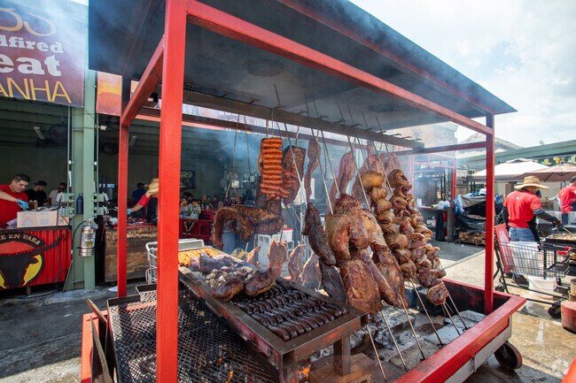Slowly Cooking rack of meat at the Yellow Green Fresh market near Park East