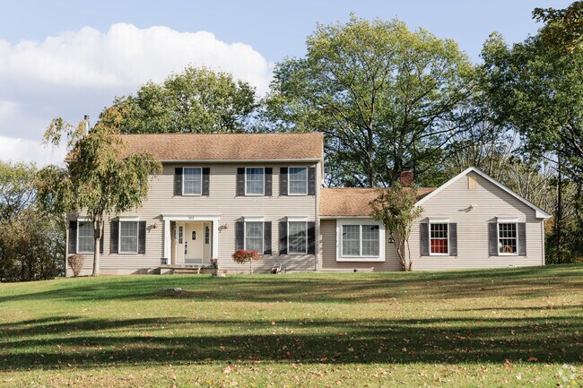 Newer colonial-style homes in Wantage often include garages and modern amenities.