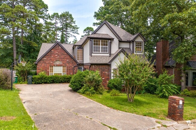 This red brick home in Walnut Valley features Tudor-style accents.